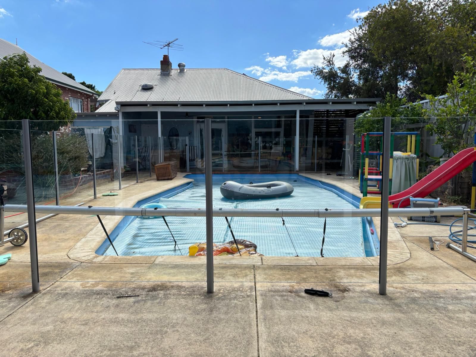 Crystal clear pool glass panels after cleaning in Perth