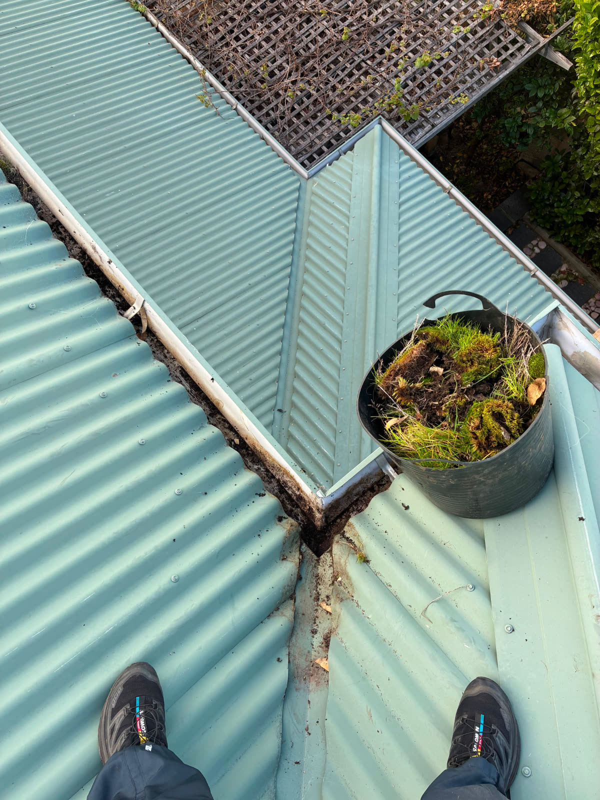 Roof valley and gutter cleared of moss and grass after cleaning in Perth
